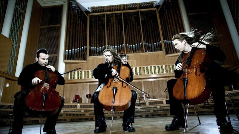 Three Cellists Performing