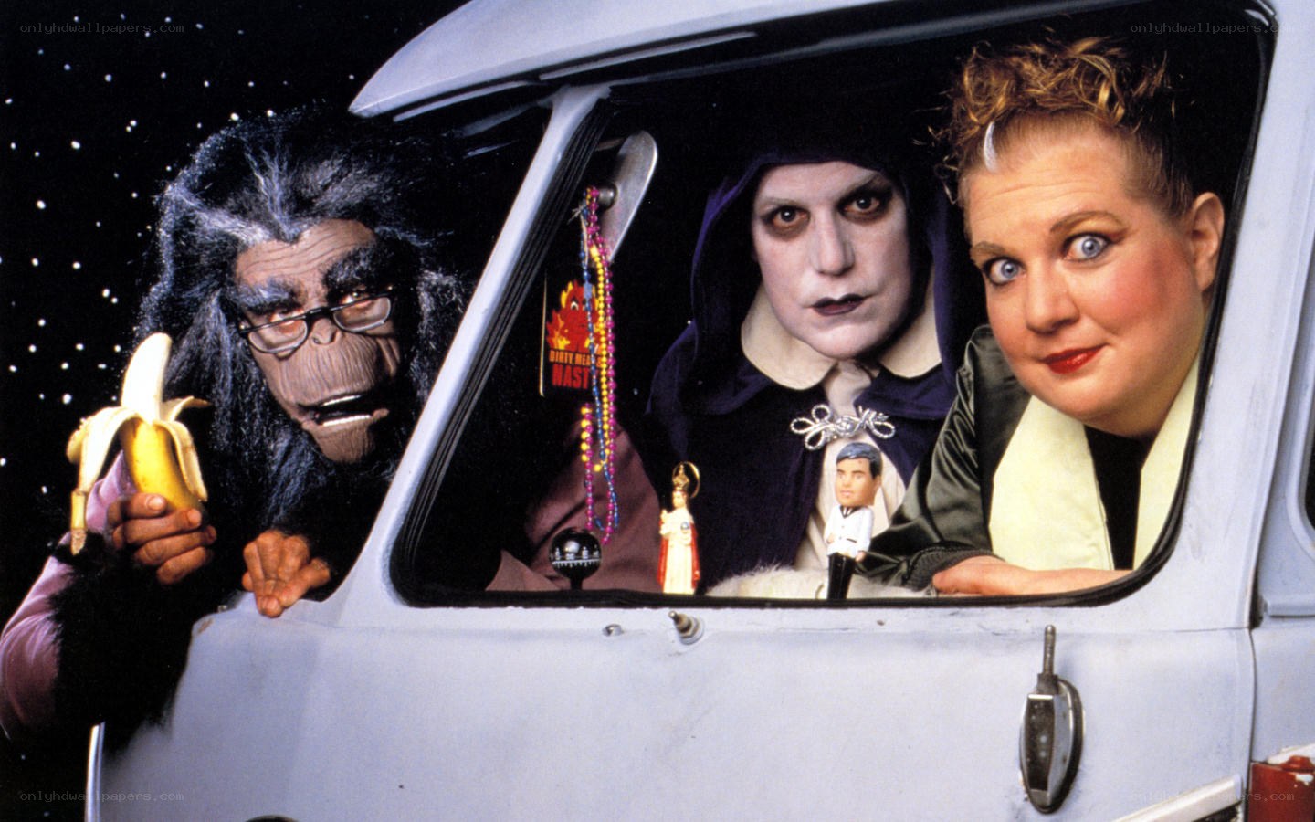 Three characters in a car