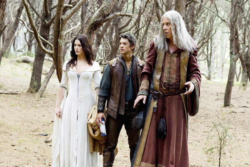 Three characters in a forest scene