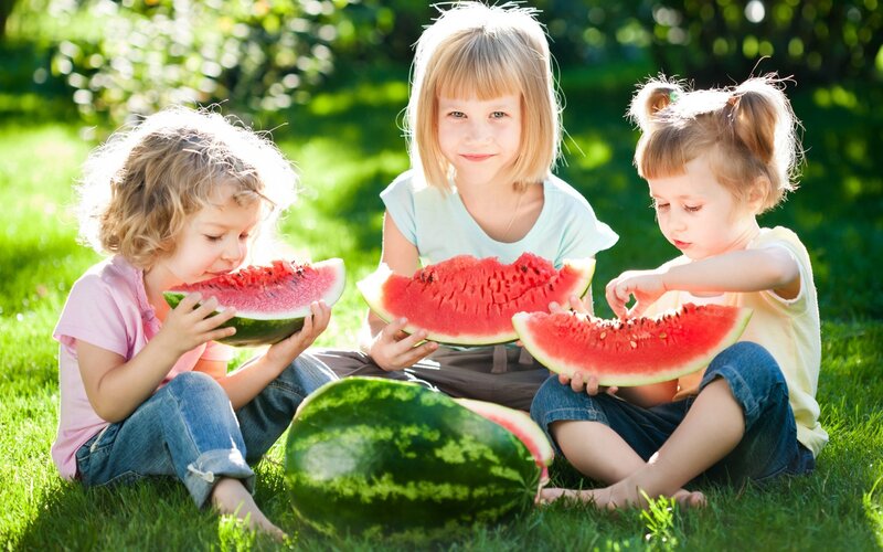 Three Children Eating Watermelon