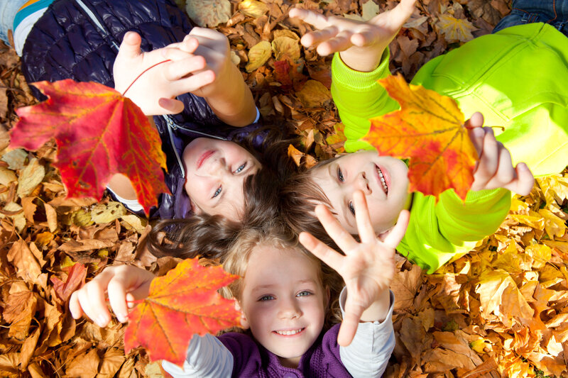 Three Children in Leaves