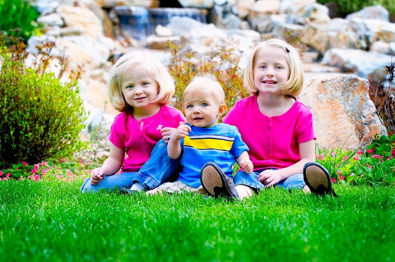 Three Children on Grass — Green, Serene