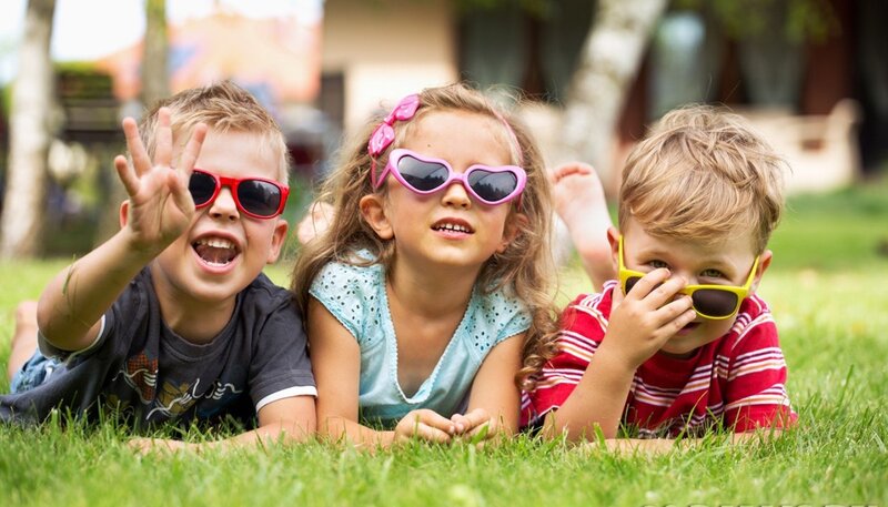 Three Children on Grass