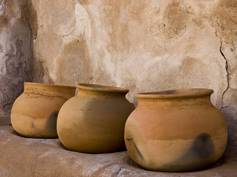 Three clay pots in a corner