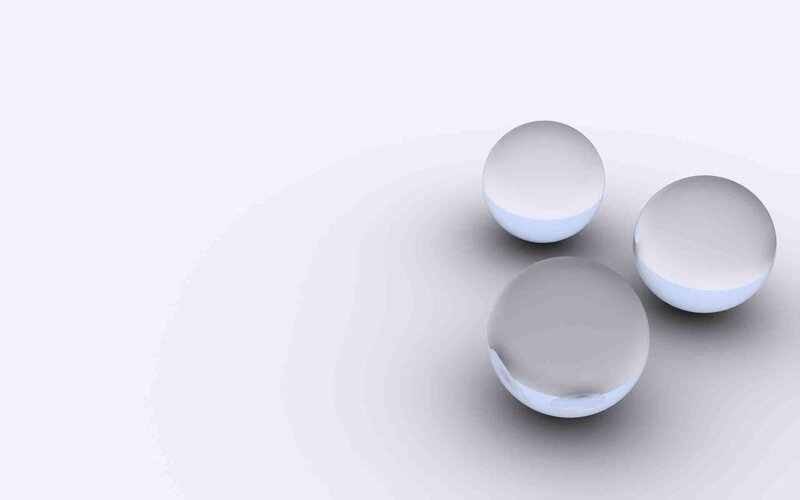 three clear spheres on white