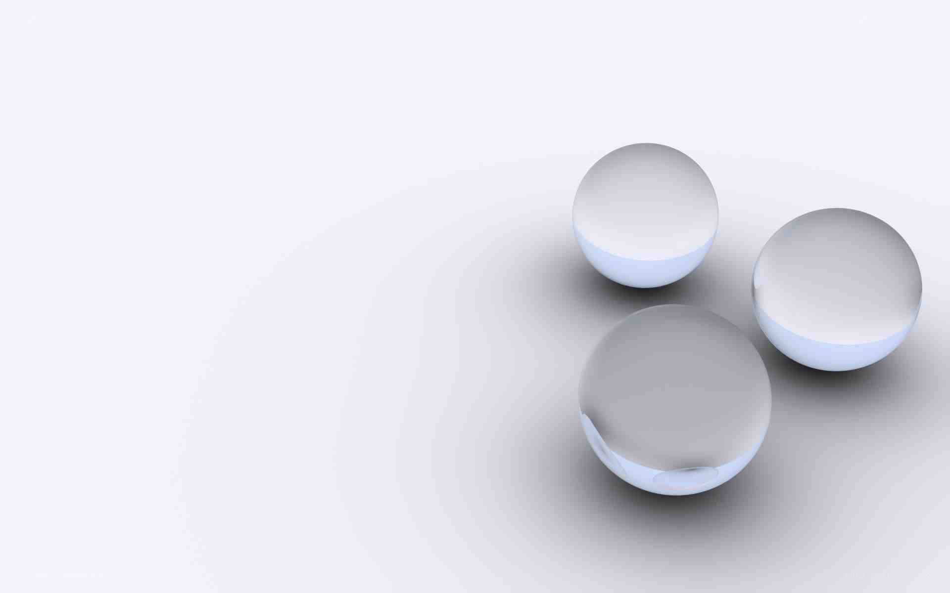 three clear spheres on white
