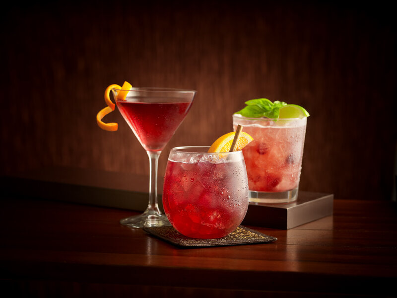 Three Cocktails on Table — Red