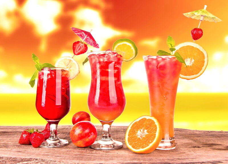 Three Cocktails on Table — Red, Tropical, Sunset