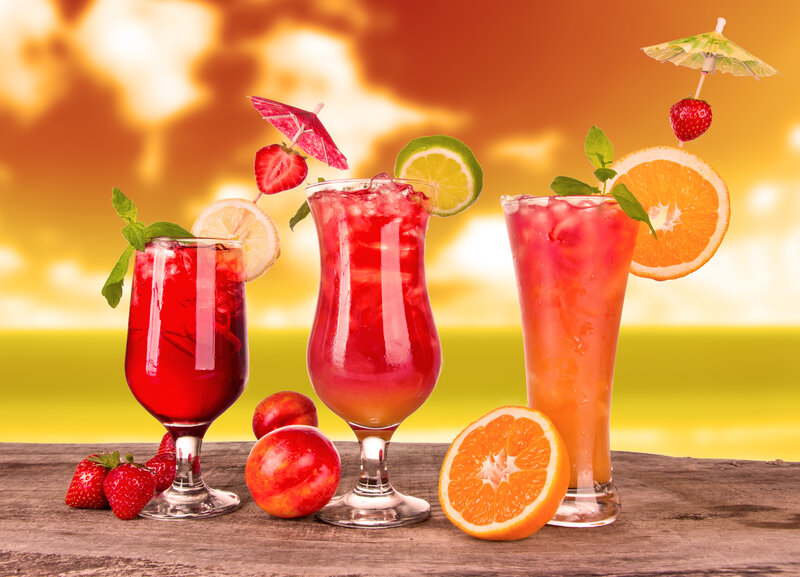 Three Cocktails on Table — Red, Tropical