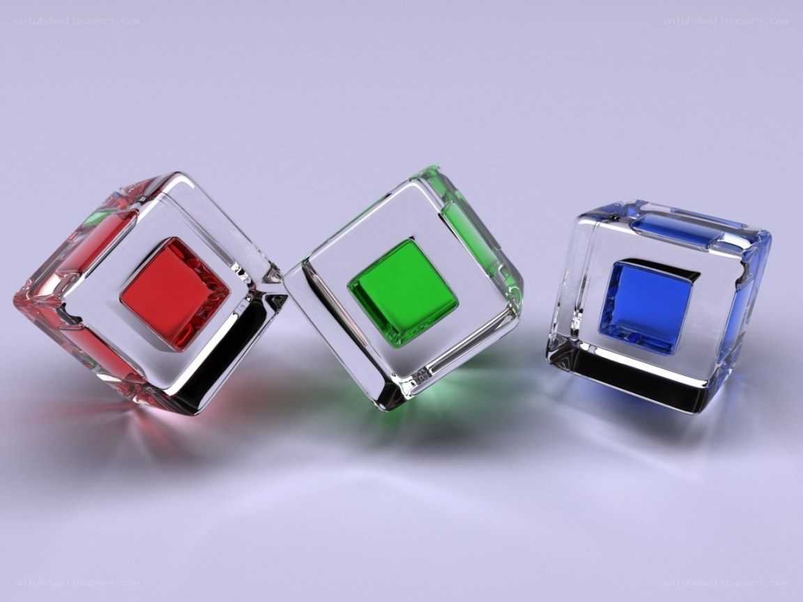 Three colored cubes on a surface