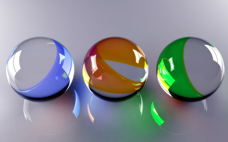 Three colored glass spheres