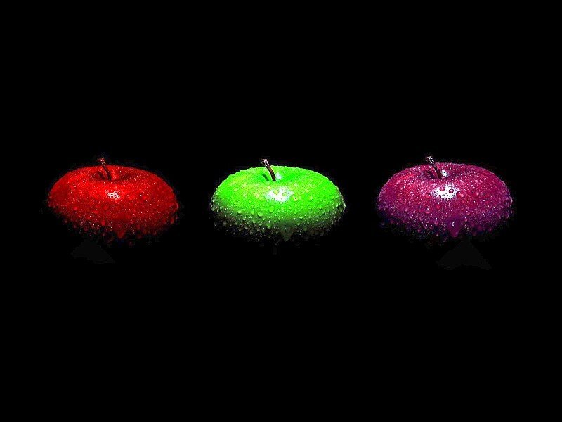 Three colorful apples on black