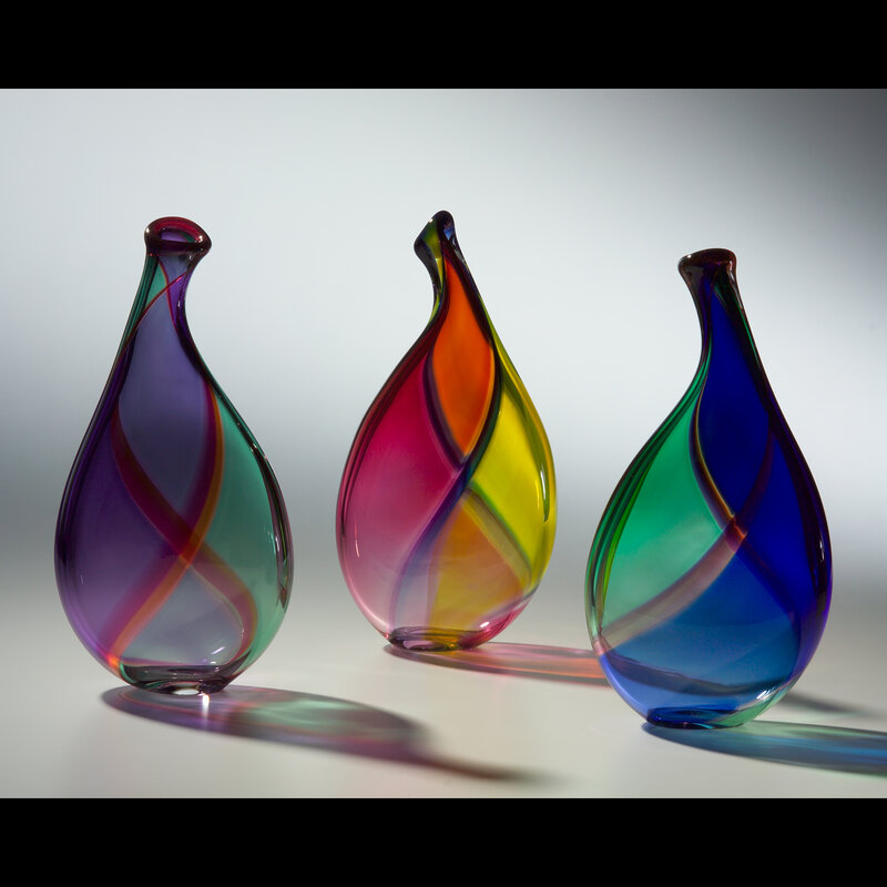 Three colorful glass vases