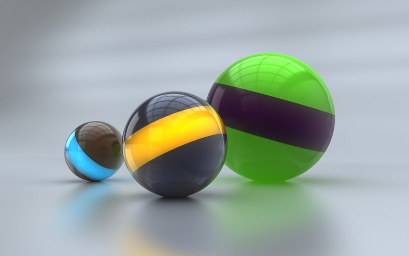 Three colorful reflective spheres