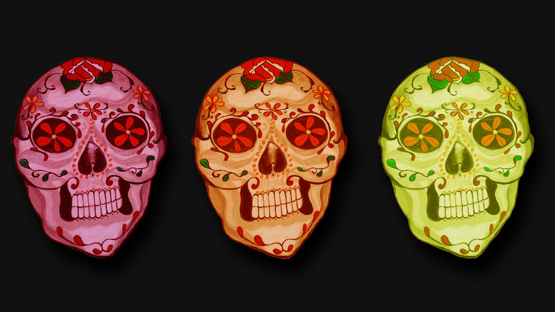 Three colorful sugar skulls