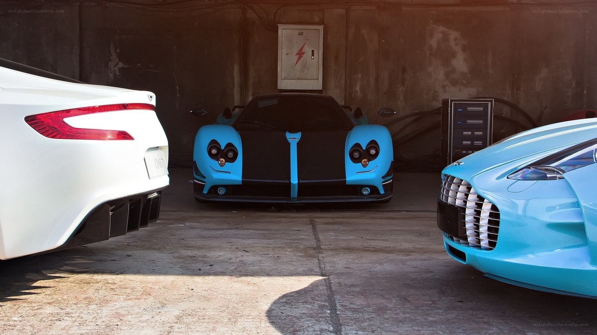 Three concept cars in a garage