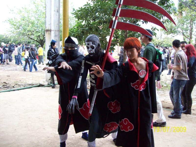 Three Cosplayers in Black Cloaks