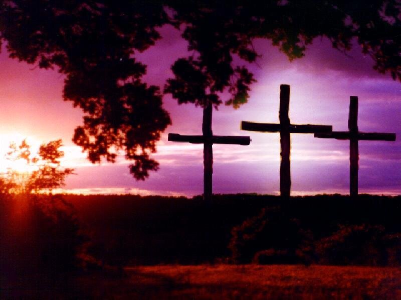 Three crosses at sunset