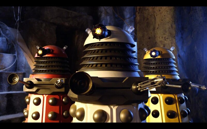Three Daleks in a cave