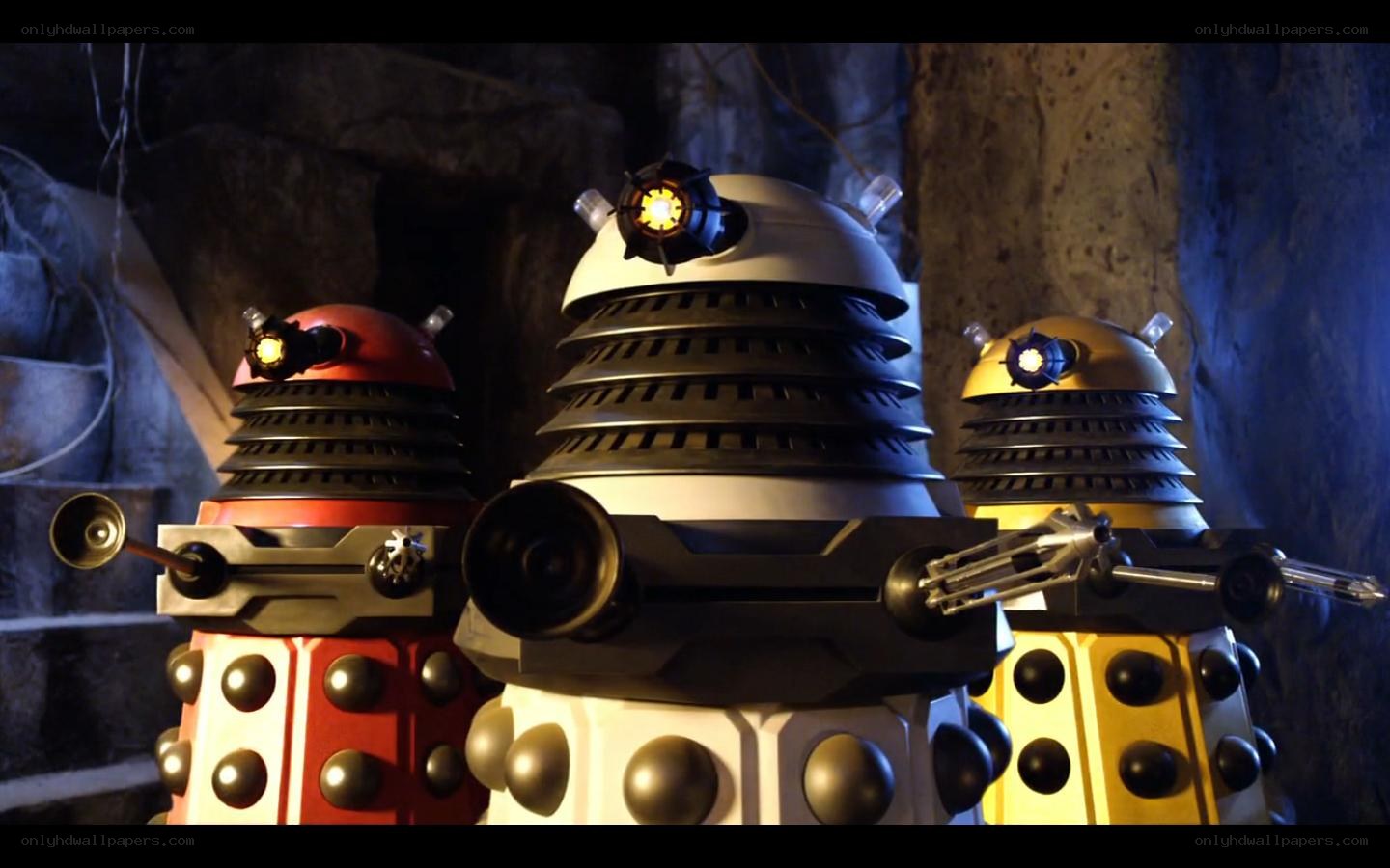 Three Daleks in a cave