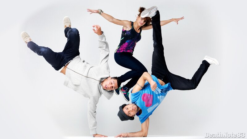 three dancers in dynamic pose