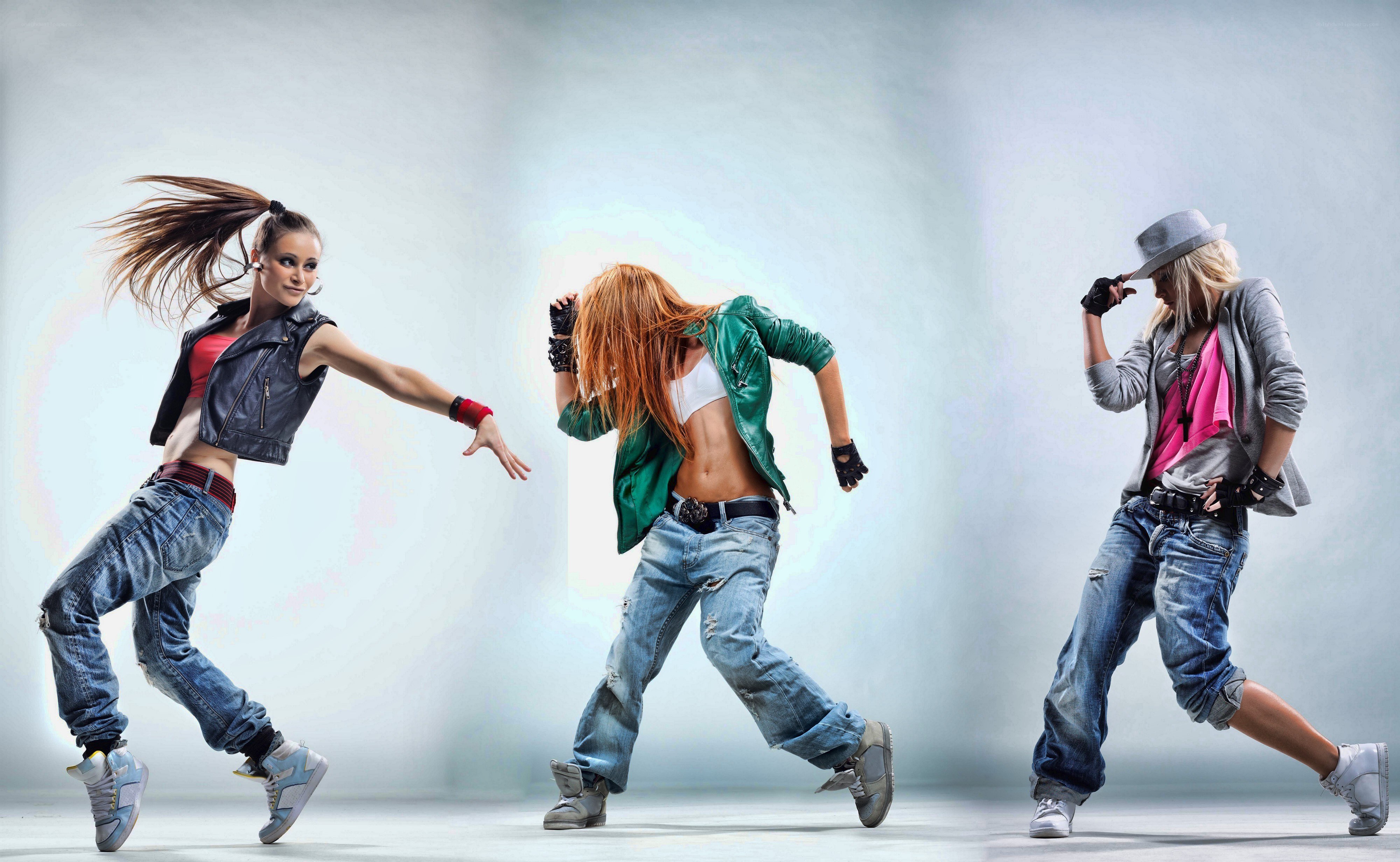 three dancers in motion