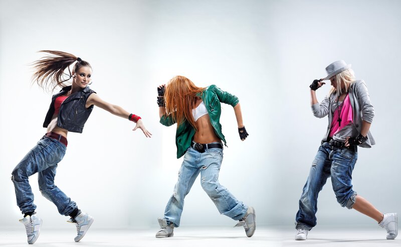 Three dancers in motion