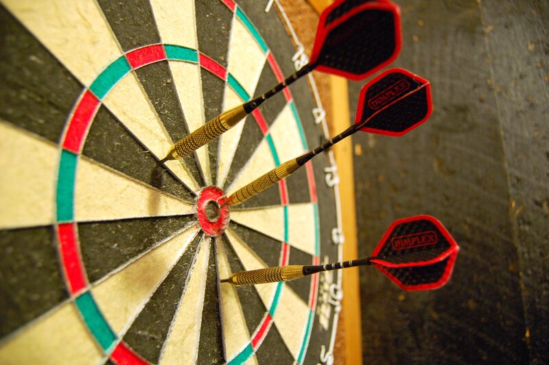 Three Darts on Dartboard