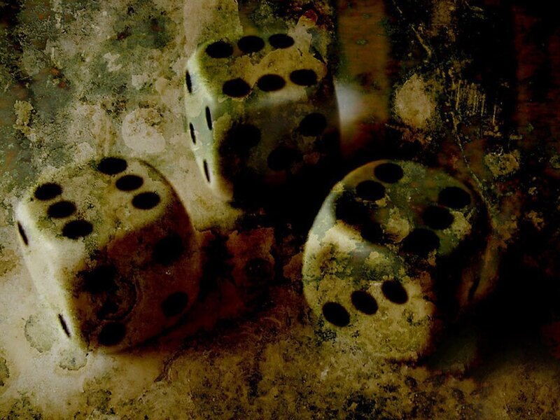 three dice on a textured surface