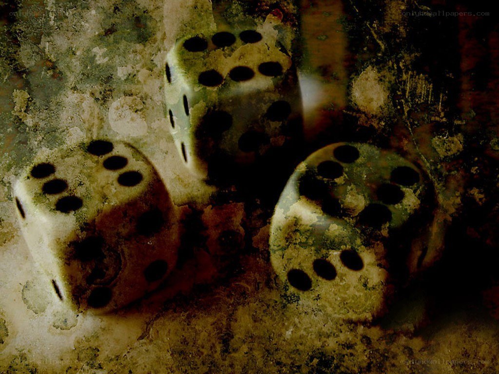 three dice on a textured surface