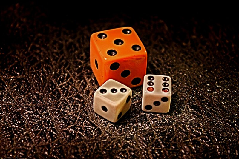 Three Dice on Textured Surface