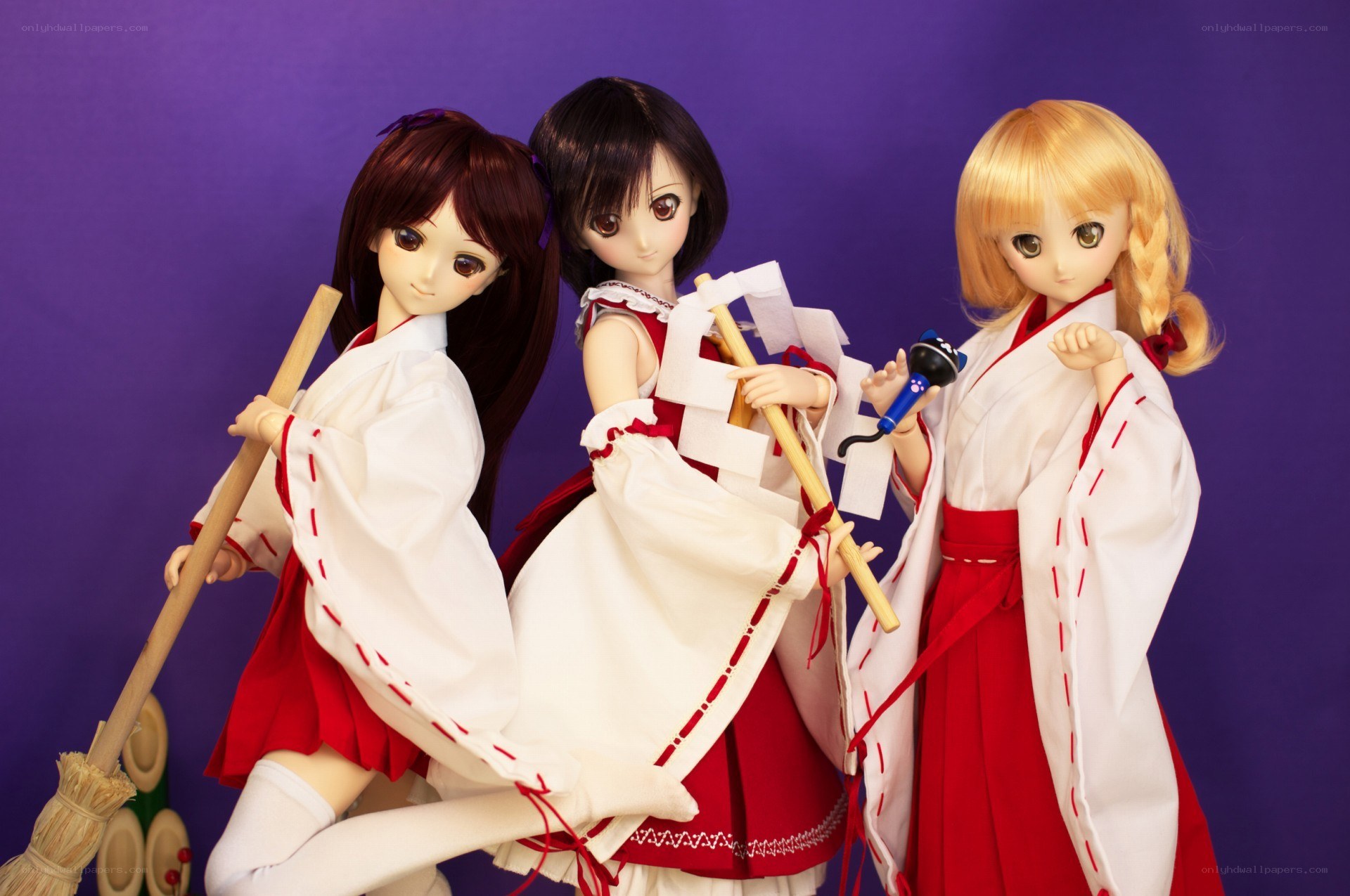 Three dolls in traditional attire
