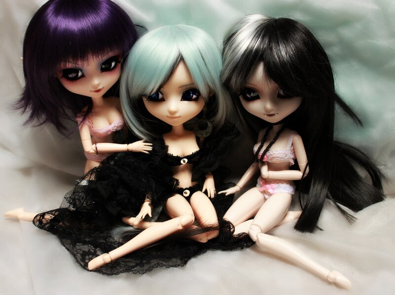 Three dolls with colorful hair