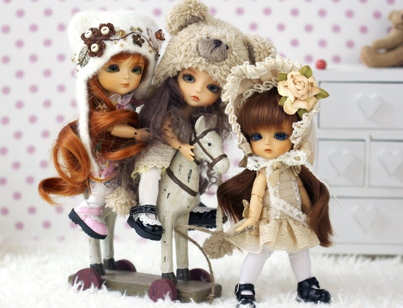 Three Dolls with Toy Horse