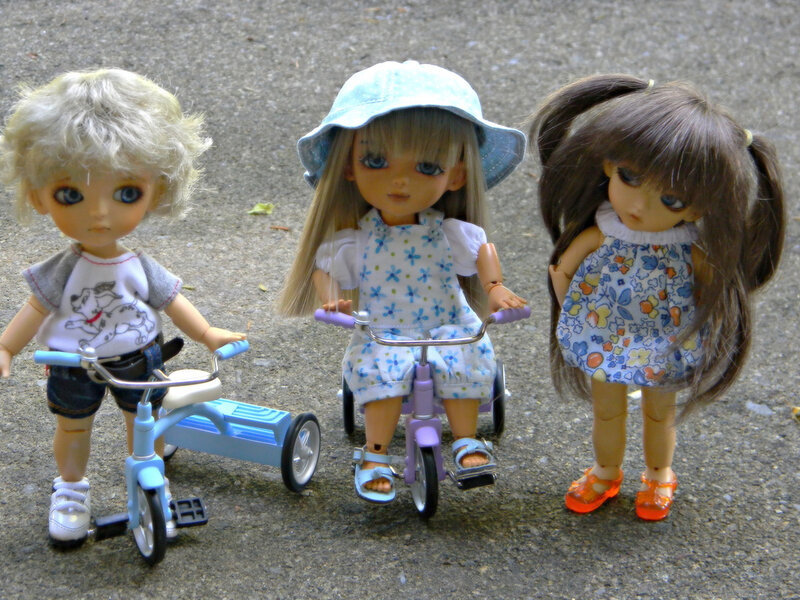 Three Dolls with Tricycles