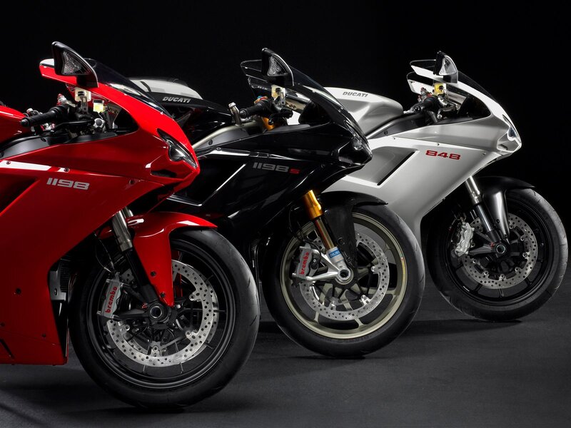 Three Ducati Motorcycles — Red, Dramatic