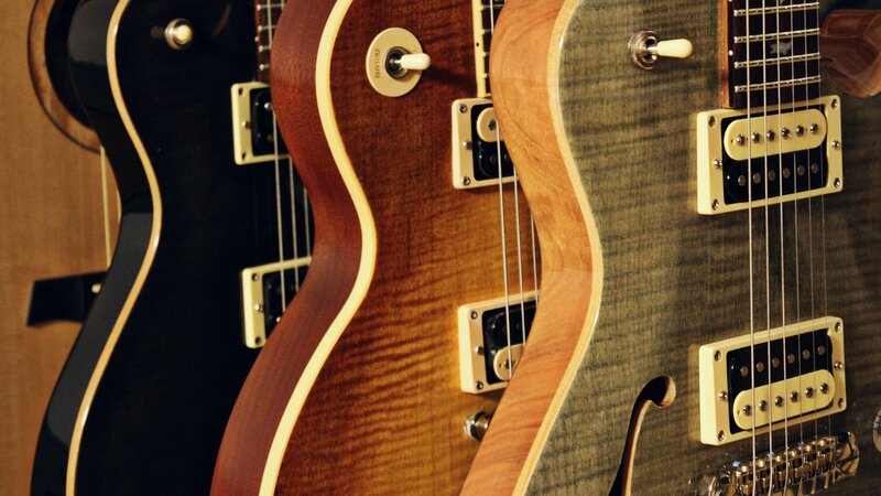 Three Electric Guitars — Brown
