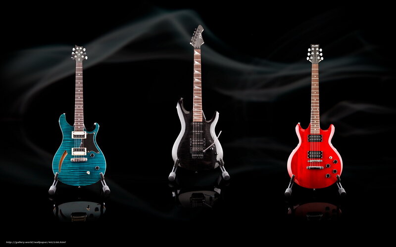 Three electric guitars on display
