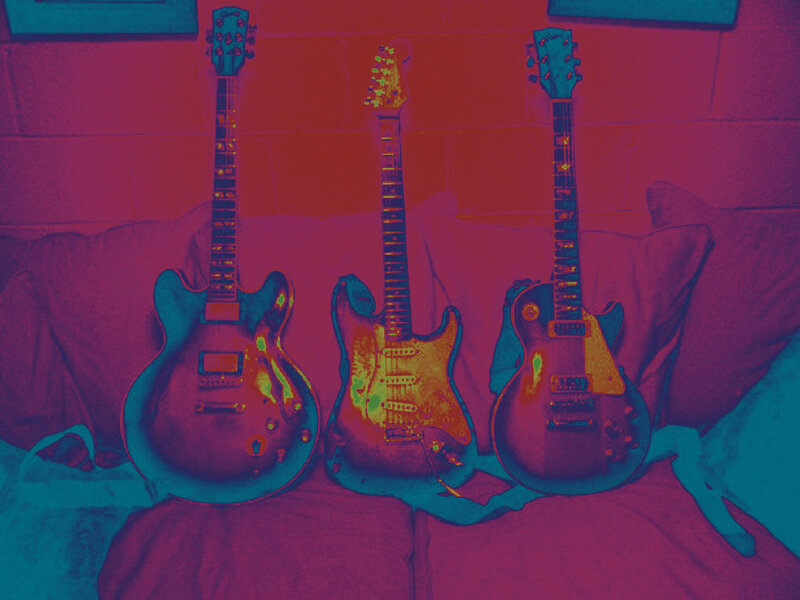 Three Electric Guitars — Purple