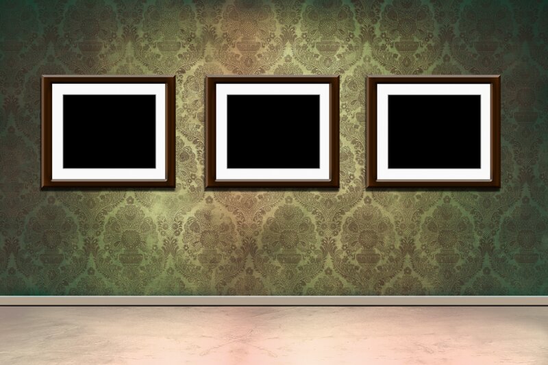 Three empty frames on a wall