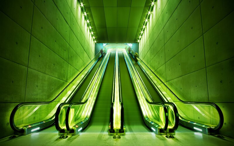 Three Escalators in Tunnel — Green, Dramatic