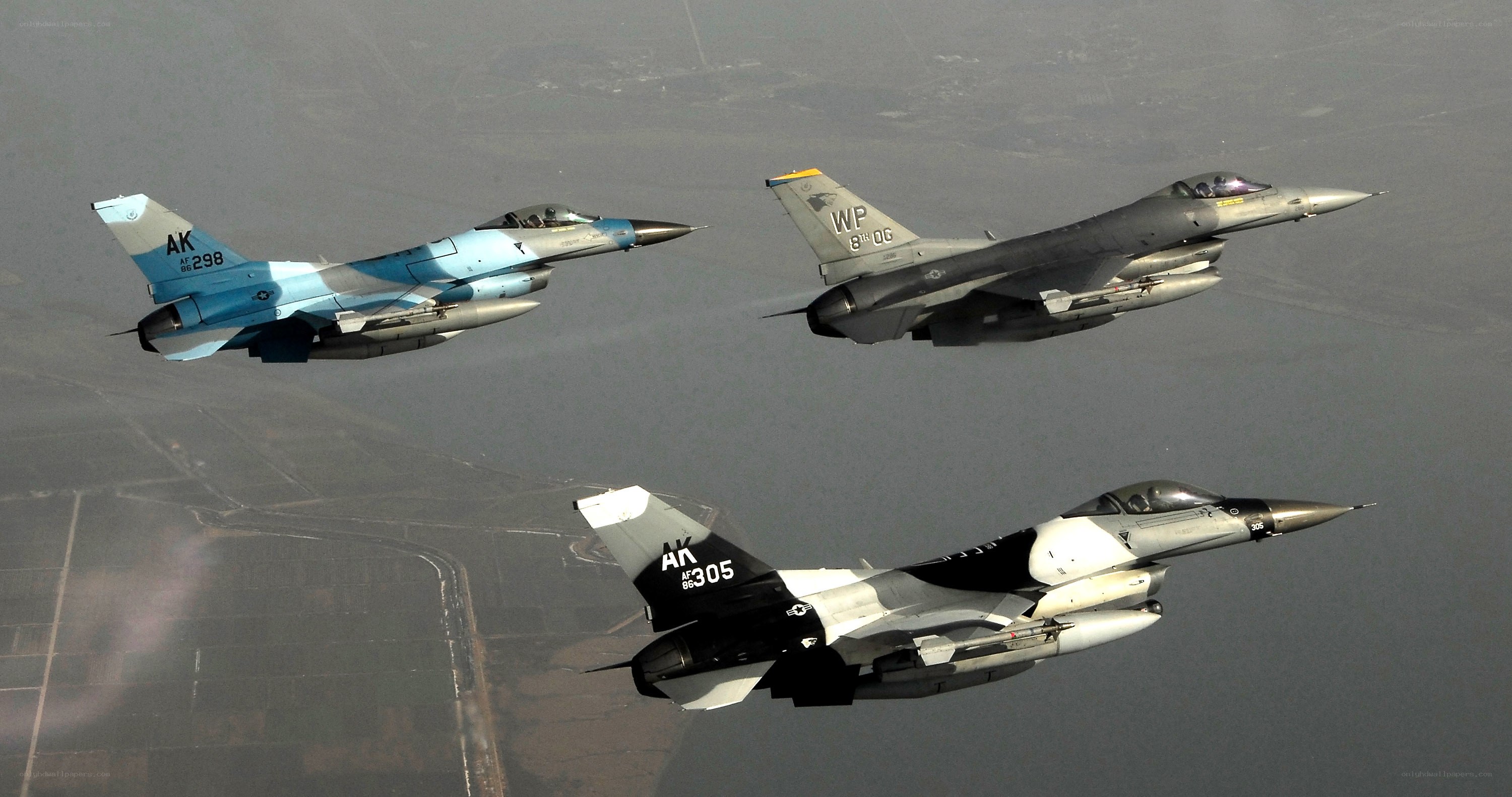 Three F-16 fighter jets in formation