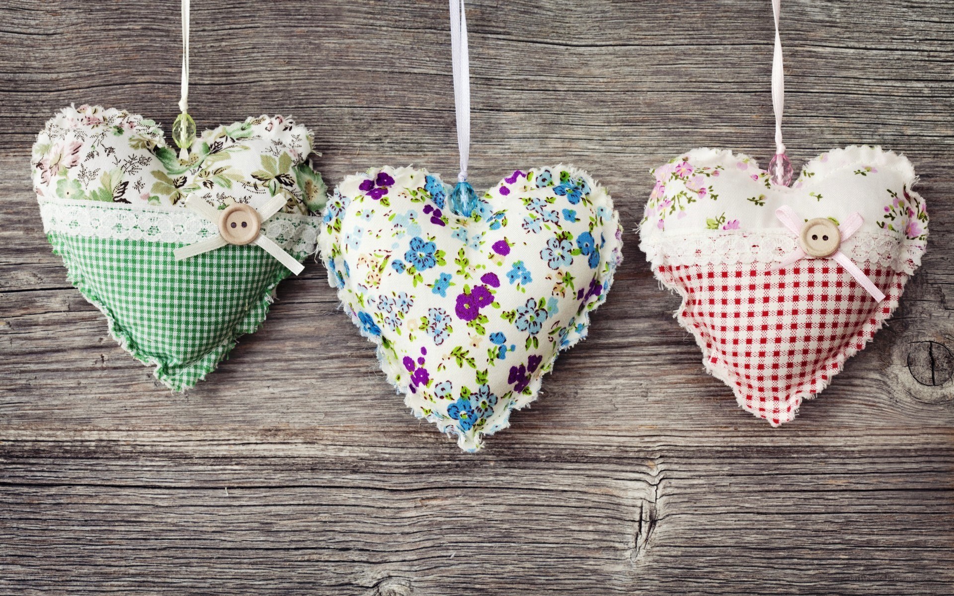 Three fabric heart ornaments