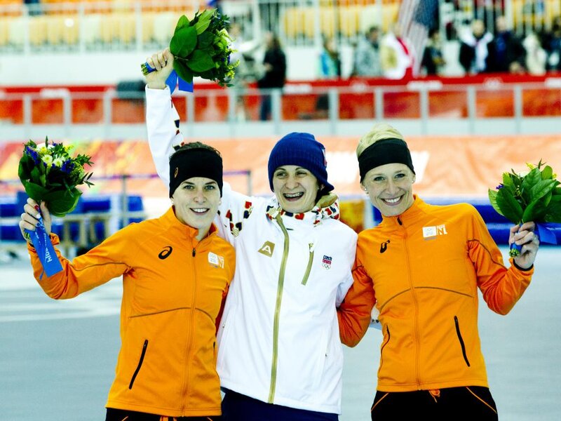 Three Female Athletes — Orange, Celebratory, Photograph
