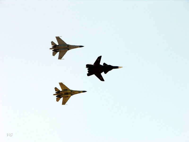 Three fighter jets in formation