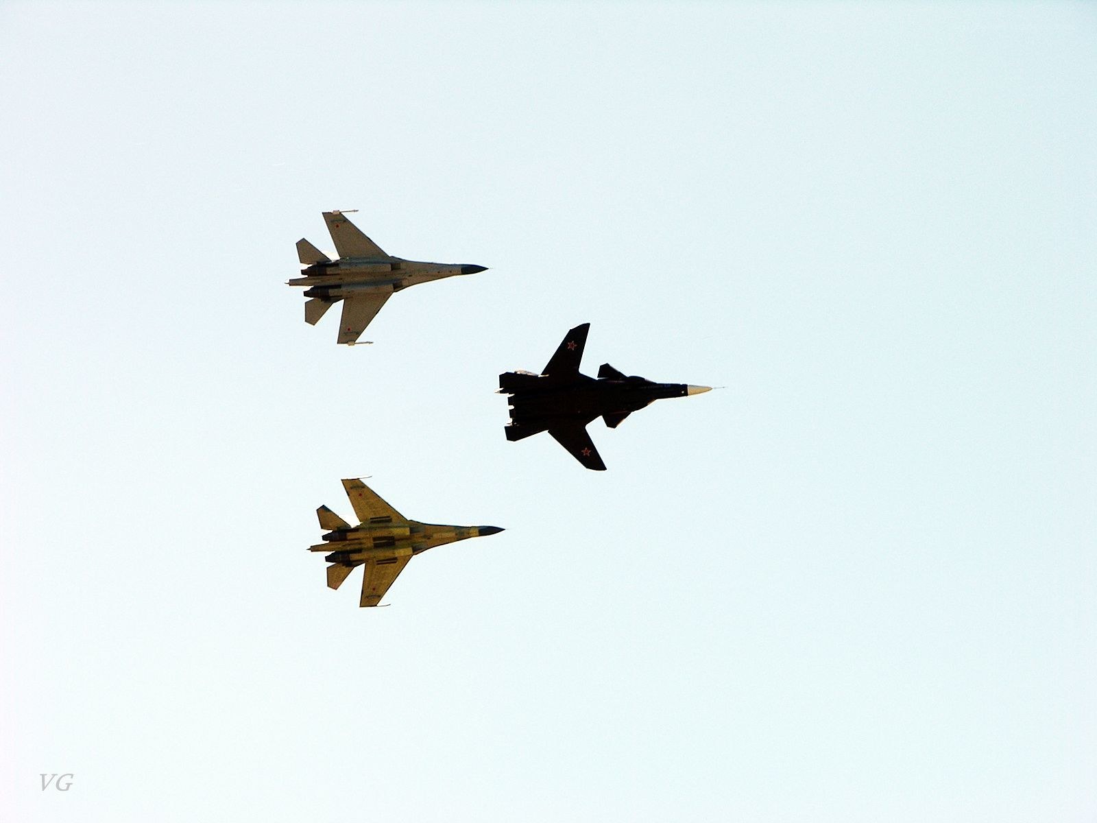 Three fighter jets in formation