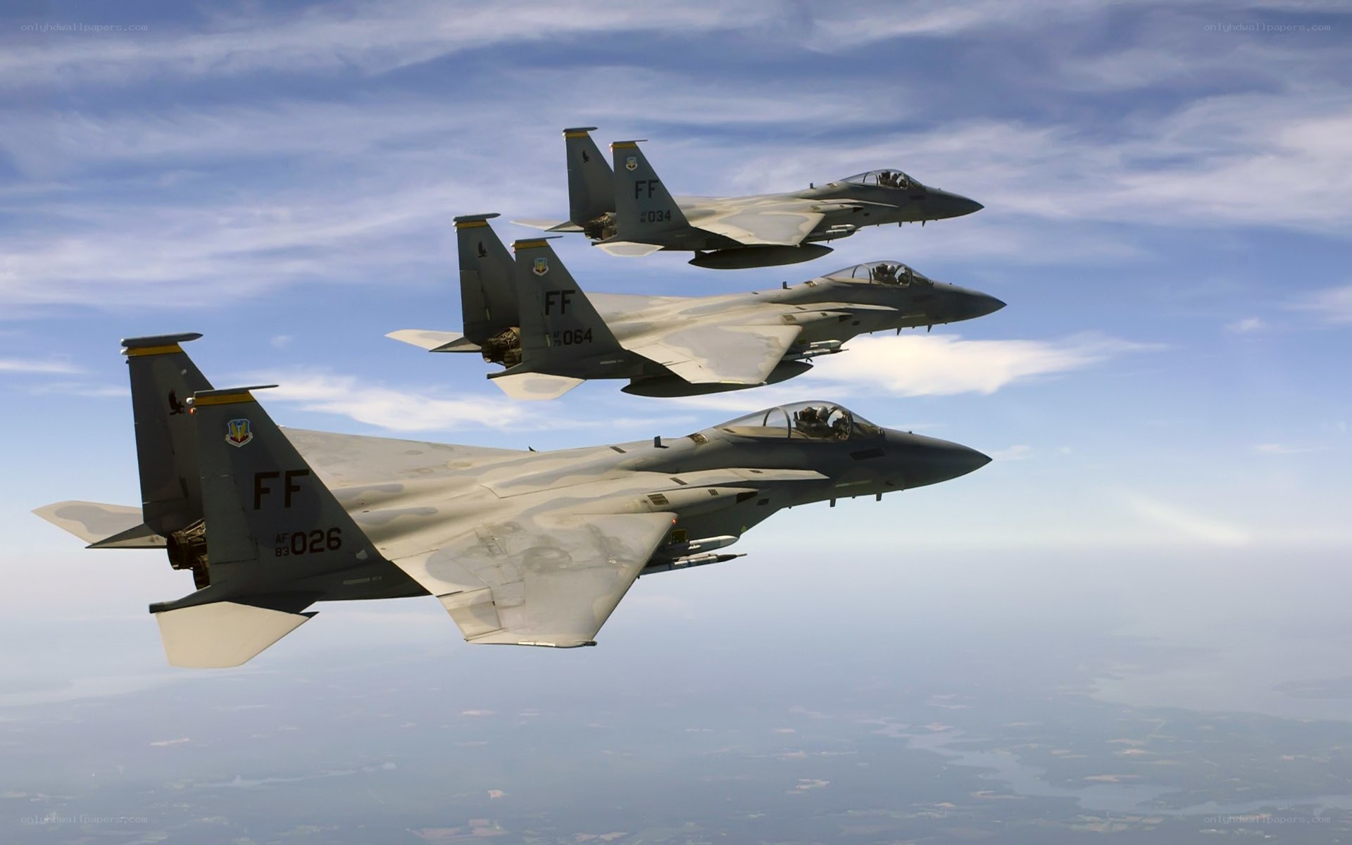 Three fighter jets in formation