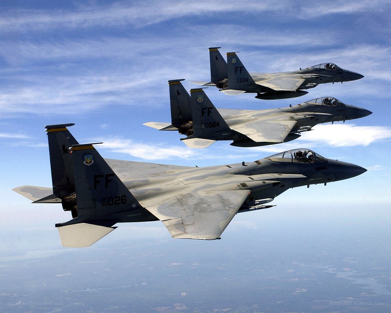 Three fighter jets in formation