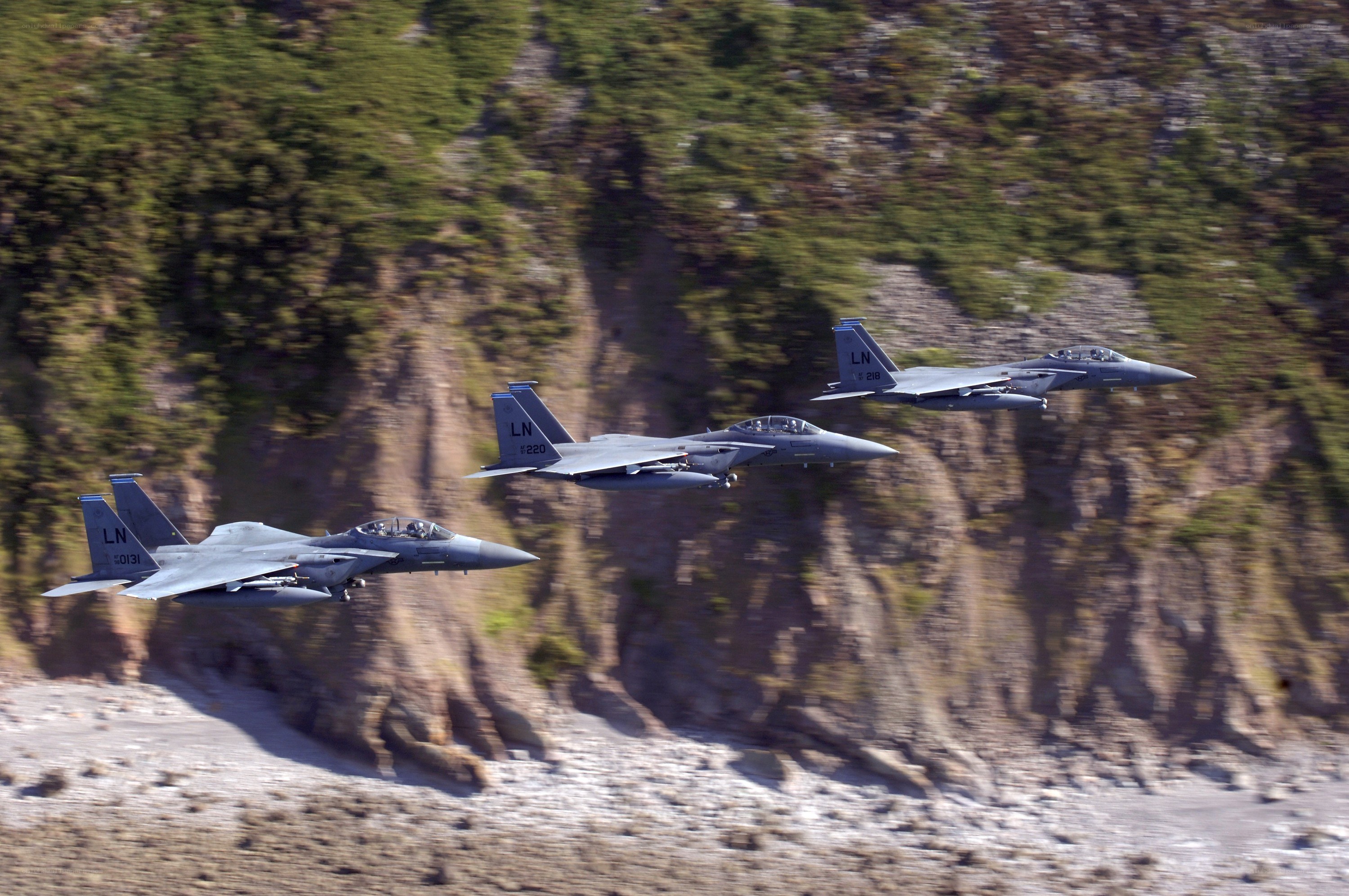 Three fighter jets in formation