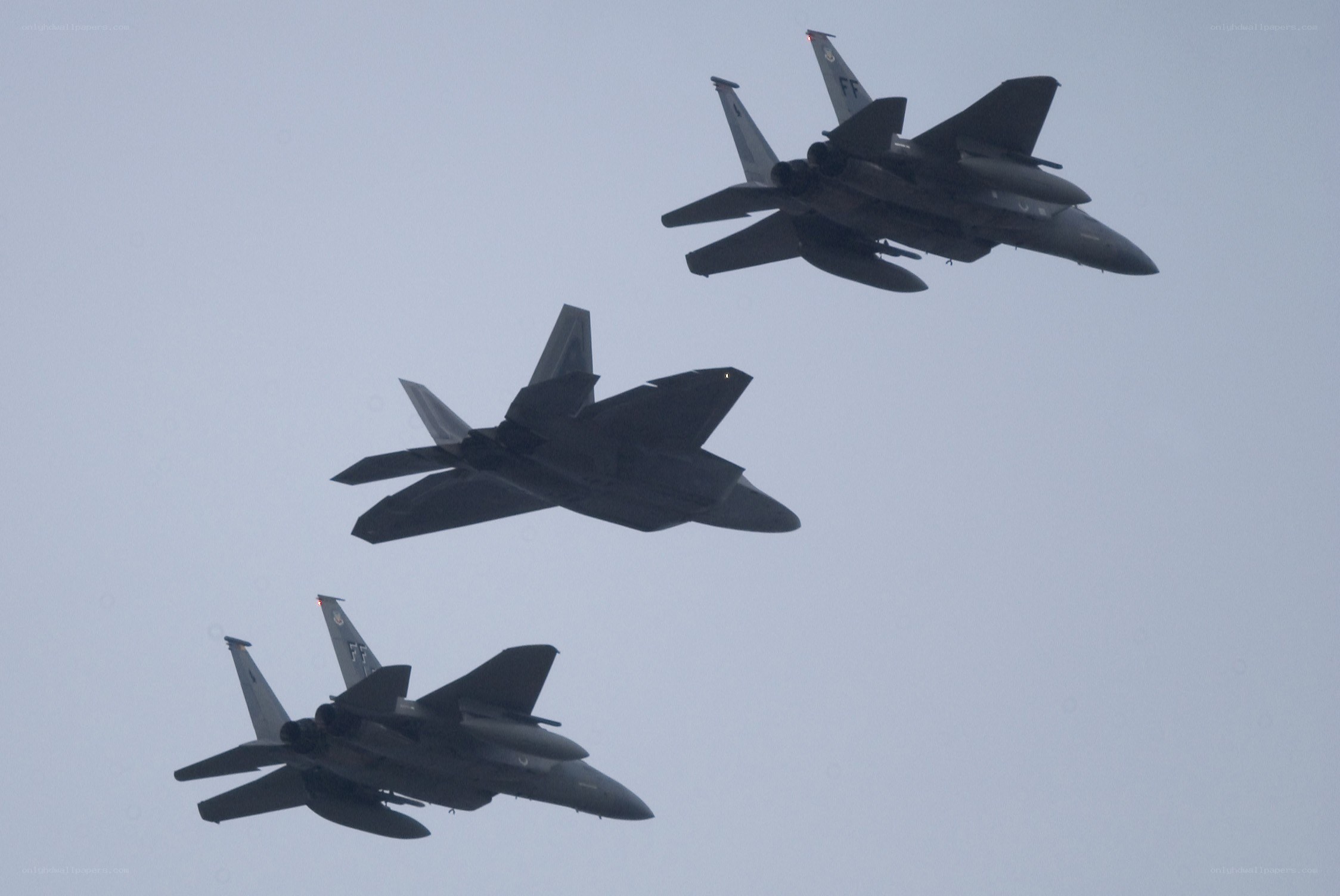 Three fighter jets in formation